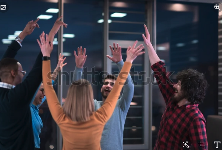 A young business team celebrating a victory