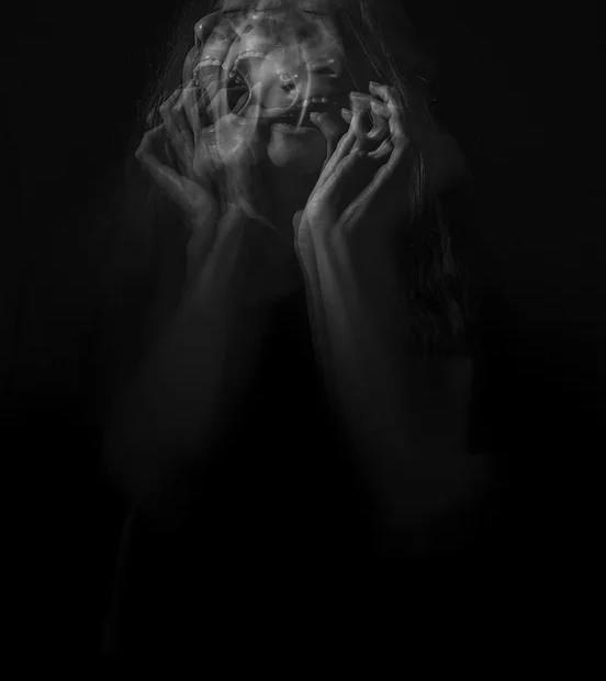 Image of a blurred woman in crisis.