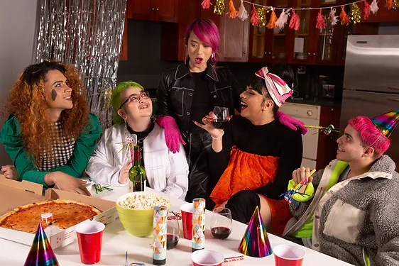 A group of friends of varying genders having a party